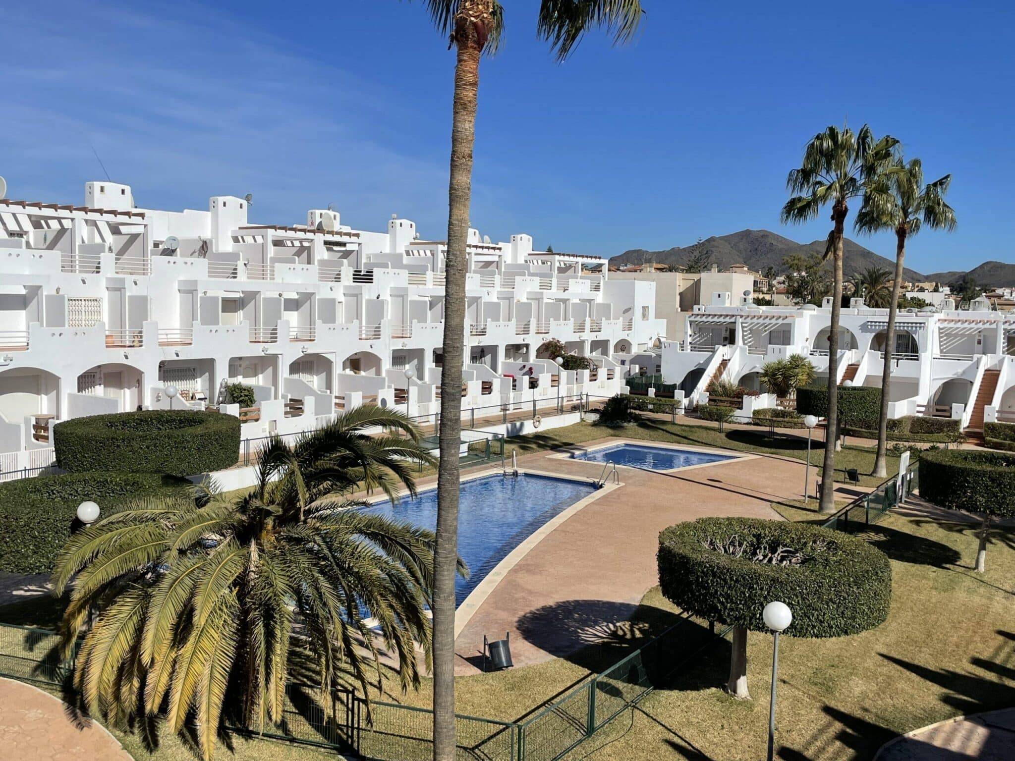 Gemeenschappelijk zwembad en tuin van Huis Te koop in Palomares (04618) in Spanje, gelegen aan de Costa de Almería